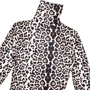 Detail showing the high neck collar and soft leopard print fabric of the long sleeve dress
