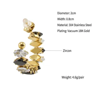 Macro view of C-shaped 18K gold-plated stainless steel earrings with zircon inlay details