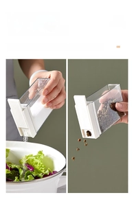 Detail showing dual-opening lid design for fine sprinkle or wide pour of spices