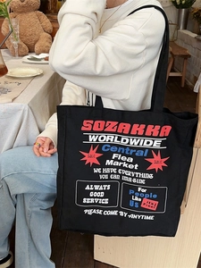 Large black canvas tote bag with retro American graffiti print for daily commuting