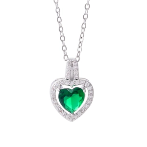 Minimalist silver necklace with a green heart-shaped zirconia pendant on white background