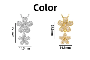 Détail des pendentifs fleurs dorés et argentés avec zircon et perle, taille 25,5 mm