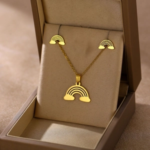 Golden rainbow necklace and earring jewelry set displayed in a premium gift box