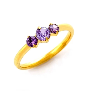 Gold plated titanium steel ring with three round purple crystals in a classic claw setting