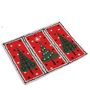 Christmas table mat featuring Santa red and green festive patterns on white background