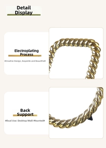 Detail of vintage gold plated mirror with rope texture frame and desktop support stand