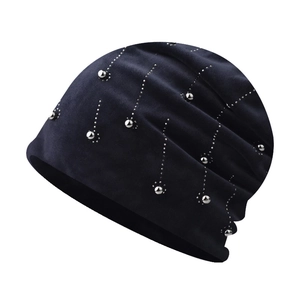 Detailed texture of navy blue chenille beanie with silver beads and rhinestones