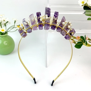 Detailed view of handmade purple crystal headband with pearls and rhinestones on gold wire
