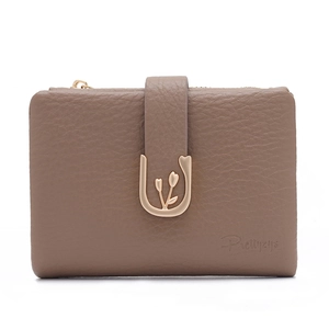 Detail of a brown lychee pattern leather wallet with a golden tulip metal buckle lock