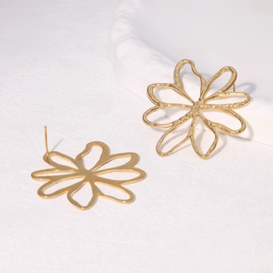 Minimalist 18k gold hollow flower stud earrings in stainless steel on white background