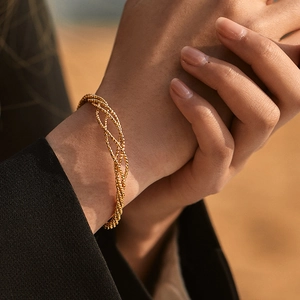 European geometric hollow woven cuff bracelet in 18K gold plated brass for women