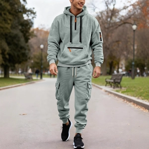 Men's grey hooded tracksuit set with utility pockets and half-zip functional design
