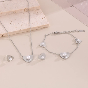 Silver heart and pearl jewelry set including necklace, bracelet, and stud earrings