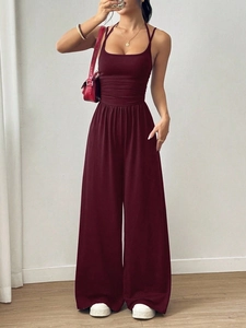 Detail of burgundy sleeveless wide-leg jumpsuit with elasticated waist for a stylish look