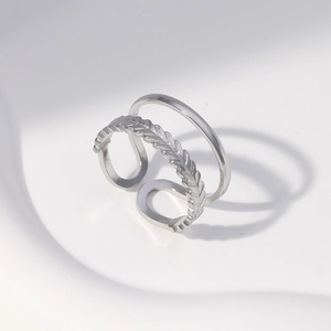 Close-up of double-layer stainless steel ring featuring a textured leaf pattern band
