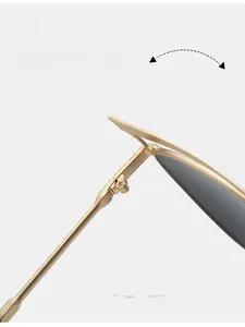 Detail shot of durable gold metal hinges on cat eye sunglasses with dark lenses