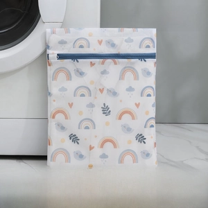 Close-up of small 30x40cm fine mesh laundry bag with rainbow prints and blue zipper
