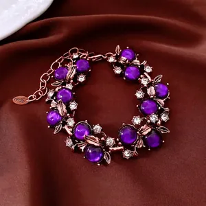 Vintage Armband in Roségold mit lila Perlen und floralen Strasssteinen