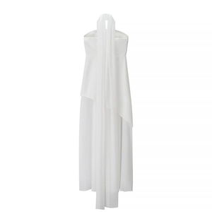 Detail view of a white mesh patchwork maxi dress with elegant neck strap and draped fabric