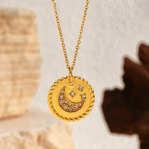 Golden pendant necklace featuring moon and star zircon motifs on a sandblasted finish