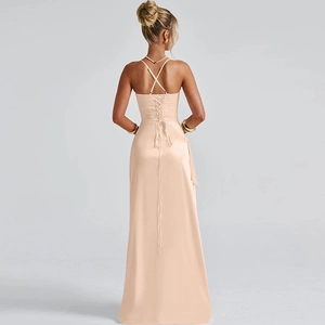 Detail of champagne satin dress featuring cross-back straps and lace-up waist design