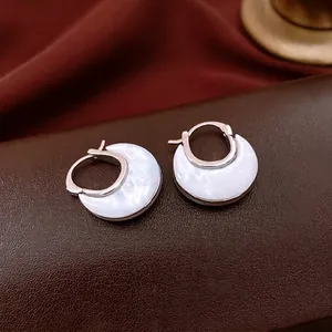 U-shaped crescent hoop earrings with mother of pearl inlay on premium leather base