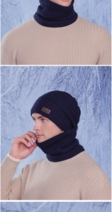 Close-up of dark blue knit hat and neck warmer set with honeycomb texture and fleece lining
