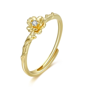 Detailed view of the 18K gold floral ring featuring a white zircon and branch texture