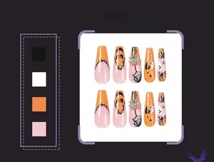 Detail of Halloween coffin press on nails featuring spider webs, ghosts and pumpkin designs