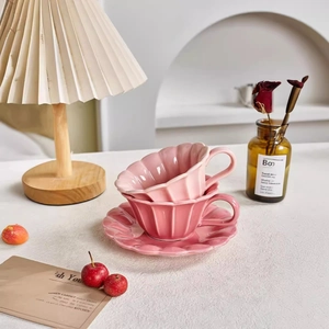 Pink petal-shaped ceramic coffee cup and saucer set with elegant pleated texture