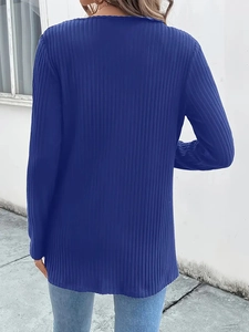 Detail view of the ribbed knit texture and back fit of the blue long sleeve cardigan