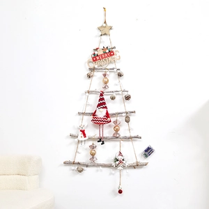 Hanging wooden branch Christmas tree with LED lights and festive ornaments on white wall