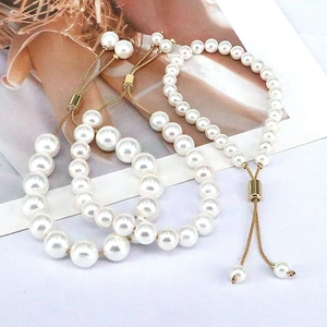Detailed view of adjustable freshwater pearl bracelets with gold sliders and snake chains