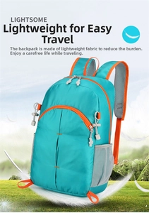 Close-up of lightweight blue hiking backpack showing mesh back padding and orange accents