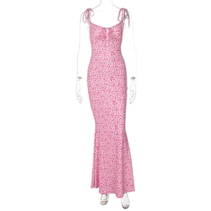 Detail of pink floral midi dress with tie-up straps and front cutout design