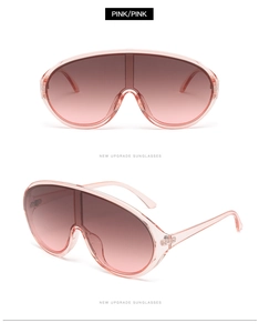 Detail view of pink gradient lenses and translucent frame of these Y2K shield sunglasses