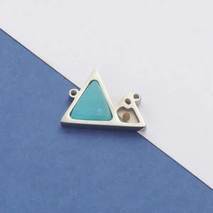 Detail view of mountain-shaped stainless steel pendant with turquoise and amber inlay