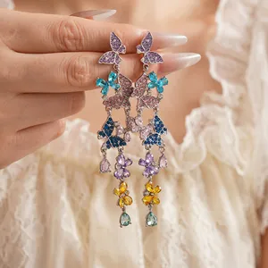 Vintage butterfly drop earrings with colorful crystals and floral dangle design