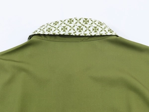 Detail view of olive green shirt collar featuring unique geometric pattern inner lining