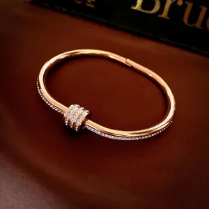 Minimalist rose gold titanium steel bracelet with sparkling pavé cubic zirconia accents