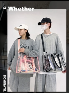 Models displaying clear PVC shoulder bags with pink and black straps for beach or daily use
