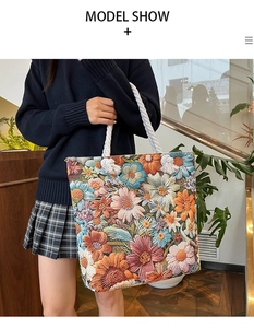 Detail of colorful floral embroidery on a canvas tote bag with thick cotton rope handles