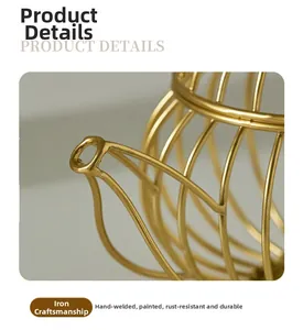 Detailed macro view of the gold iron teapot frame showing refined welding and smooth finish