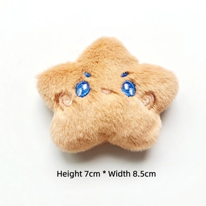 Detail showing plush star doll with blue embroidered eyes, size 7cm height by 8.5cm width