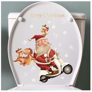 Detail of Santa Claus on a motorcycle sticker and festive icons on a toilet lid cover