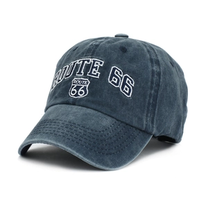Detailed embroidery of Route 66 shield on a washed navy denim baseball cap for men