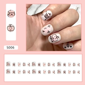 Sweet blush pink and white press-on nails with cute apple and puppy doodle art