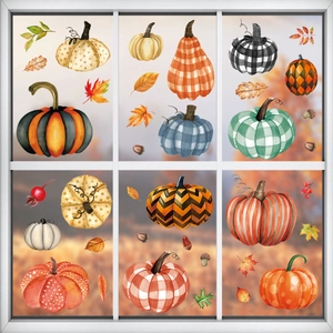 Autumn window clings set with pumpkins and fall leaves on glass for Thanksgiving decoration