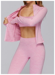 Detail of heather pink yoga set featuring thumbhole sleeves and high-waist seamless leggings