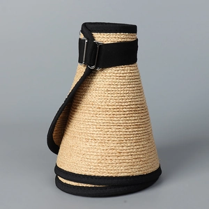 Detail of raffia sun hat with adjustable black strap and metal buckle for women